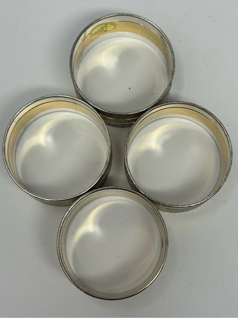 Vintage Set of 4 Two-Tone Gold and Silver Metal Napkin Rings Made in Hong Kong